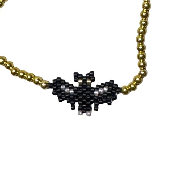 Handcrafted Black and Gold Beaded Bat Stretch Bracelet - Picture 3 of 5
